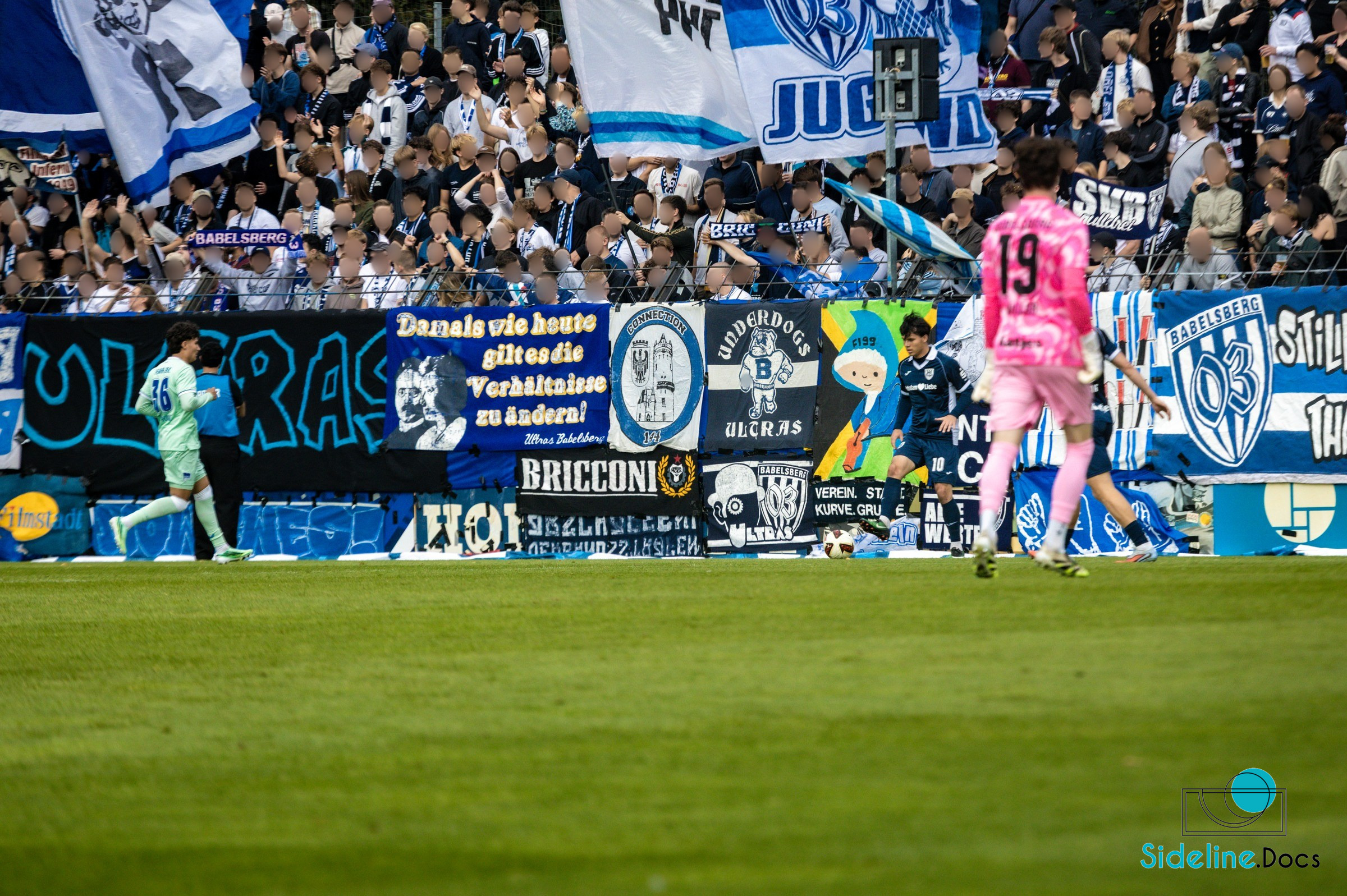 Close challenge in front of flags and banners