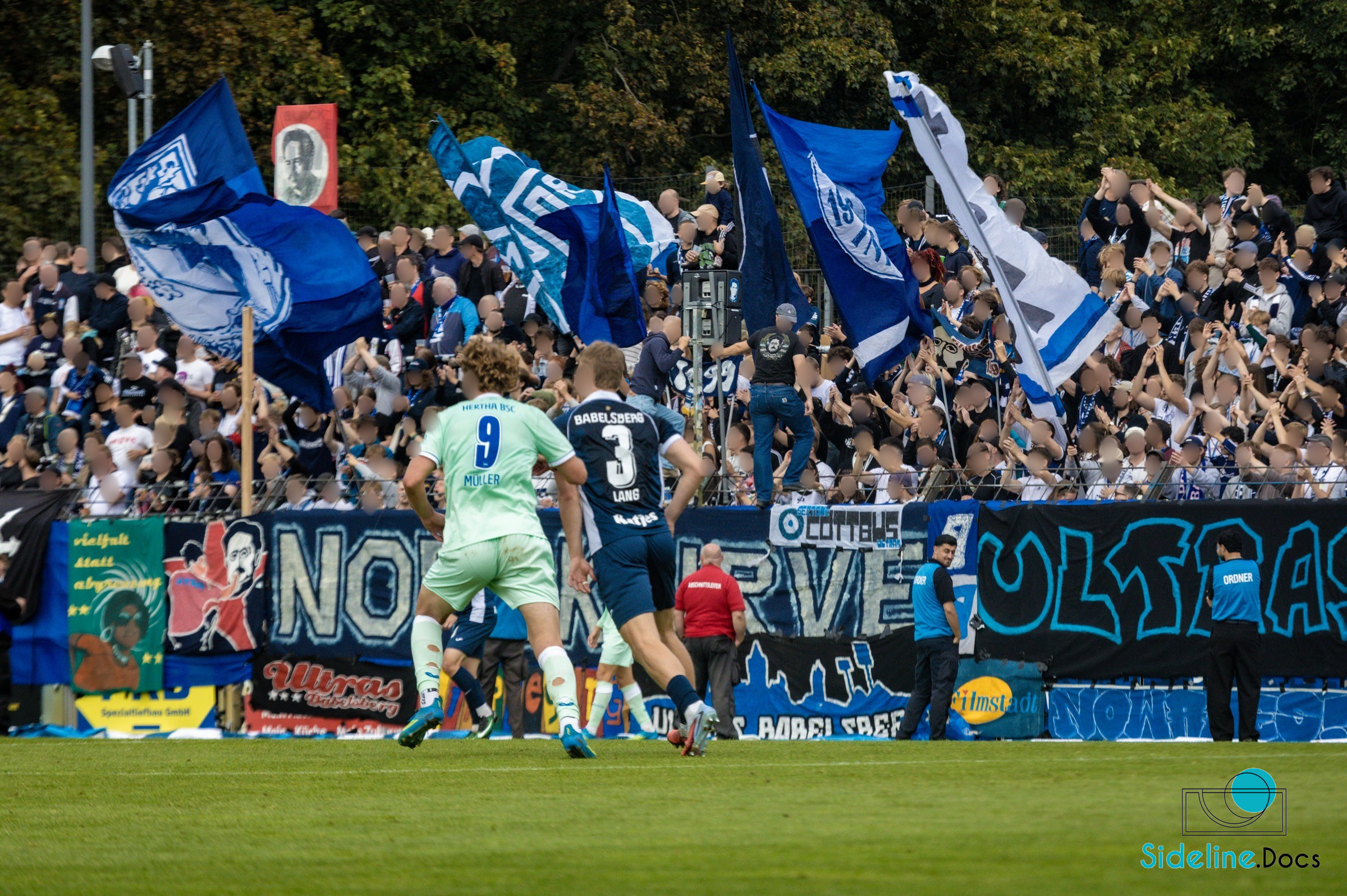 Challenge in front of the north stand flags