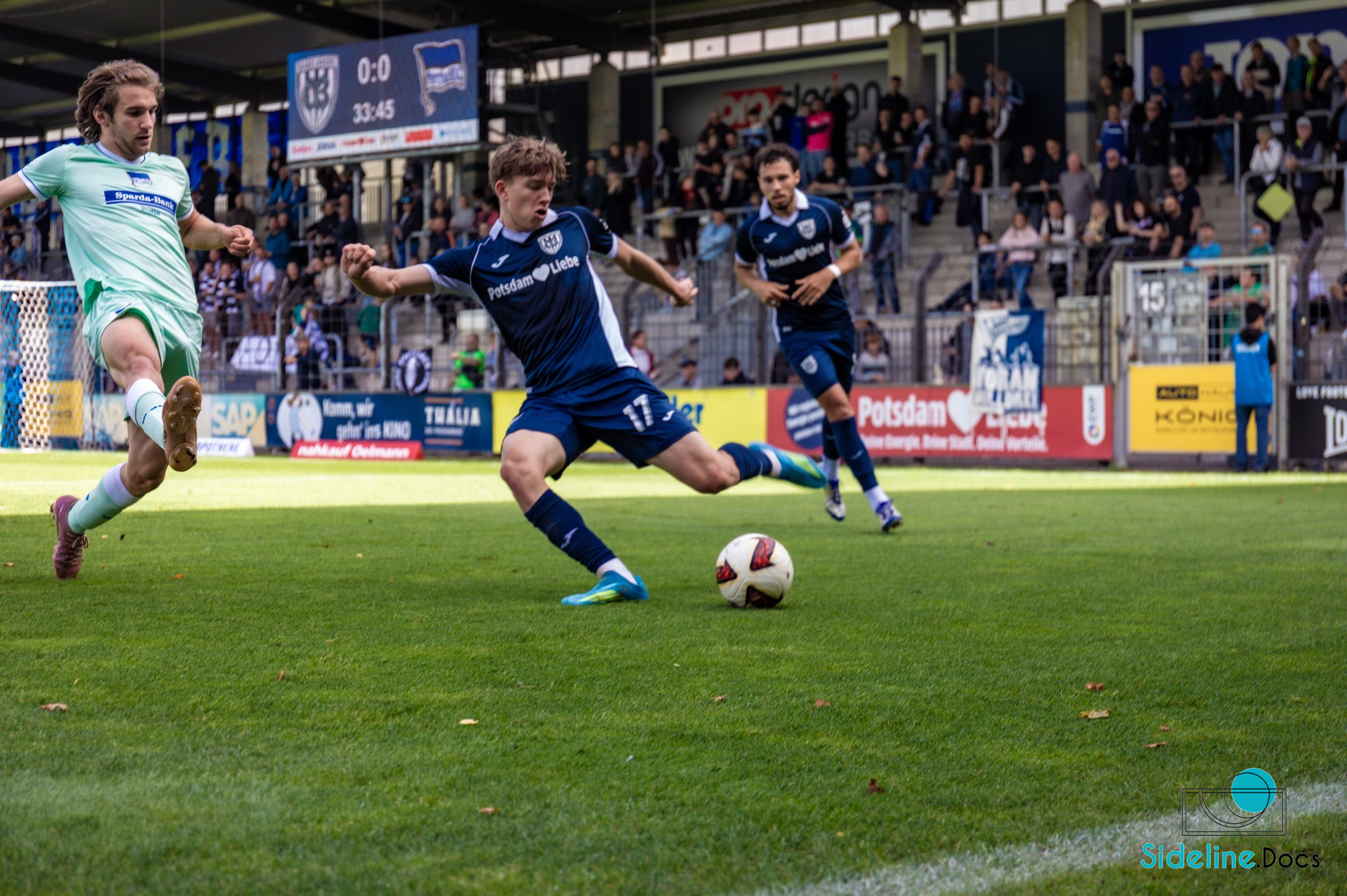 Close challenge in front of the main stand