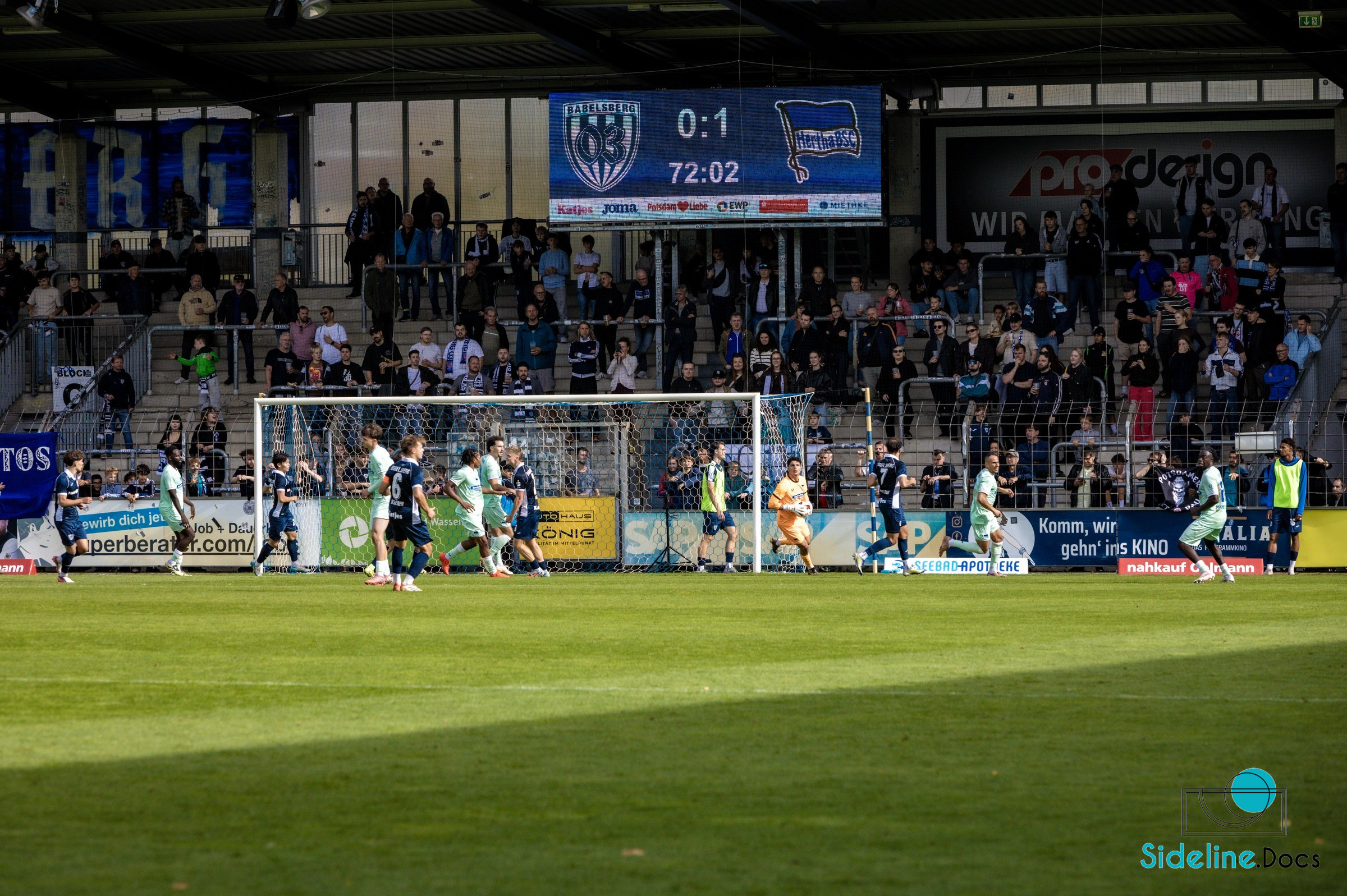 Penalty-box scene in front of the main stand