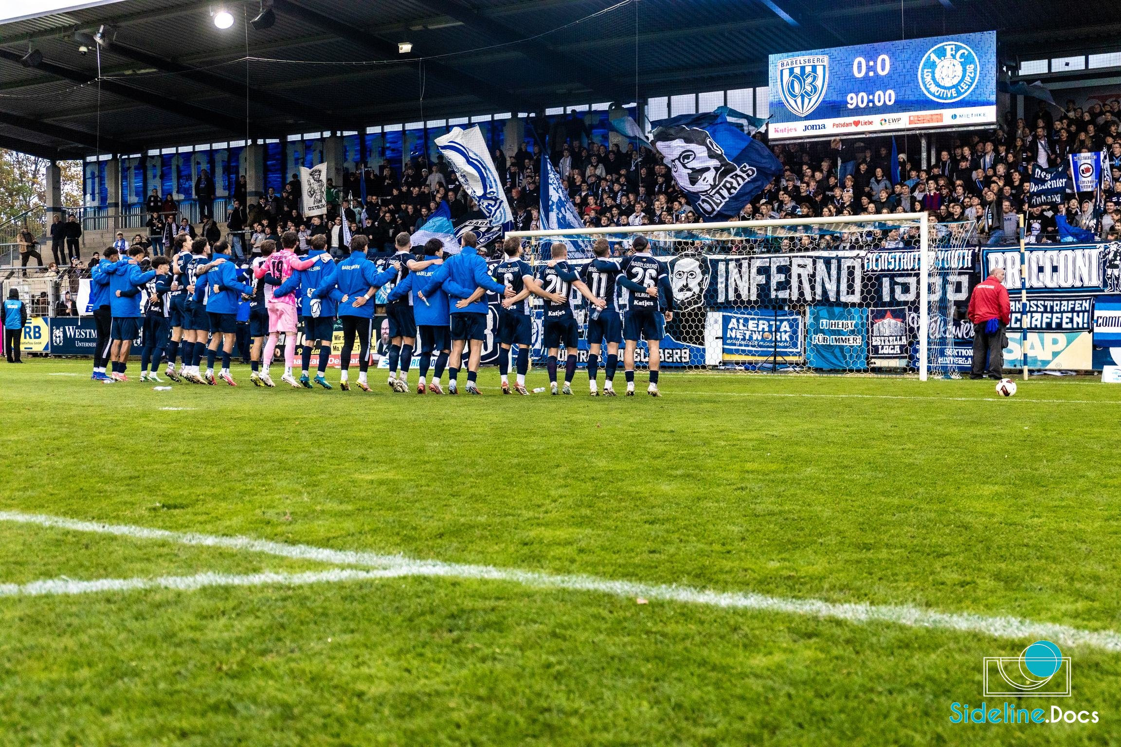 Team line facing the home curve after the final whistle