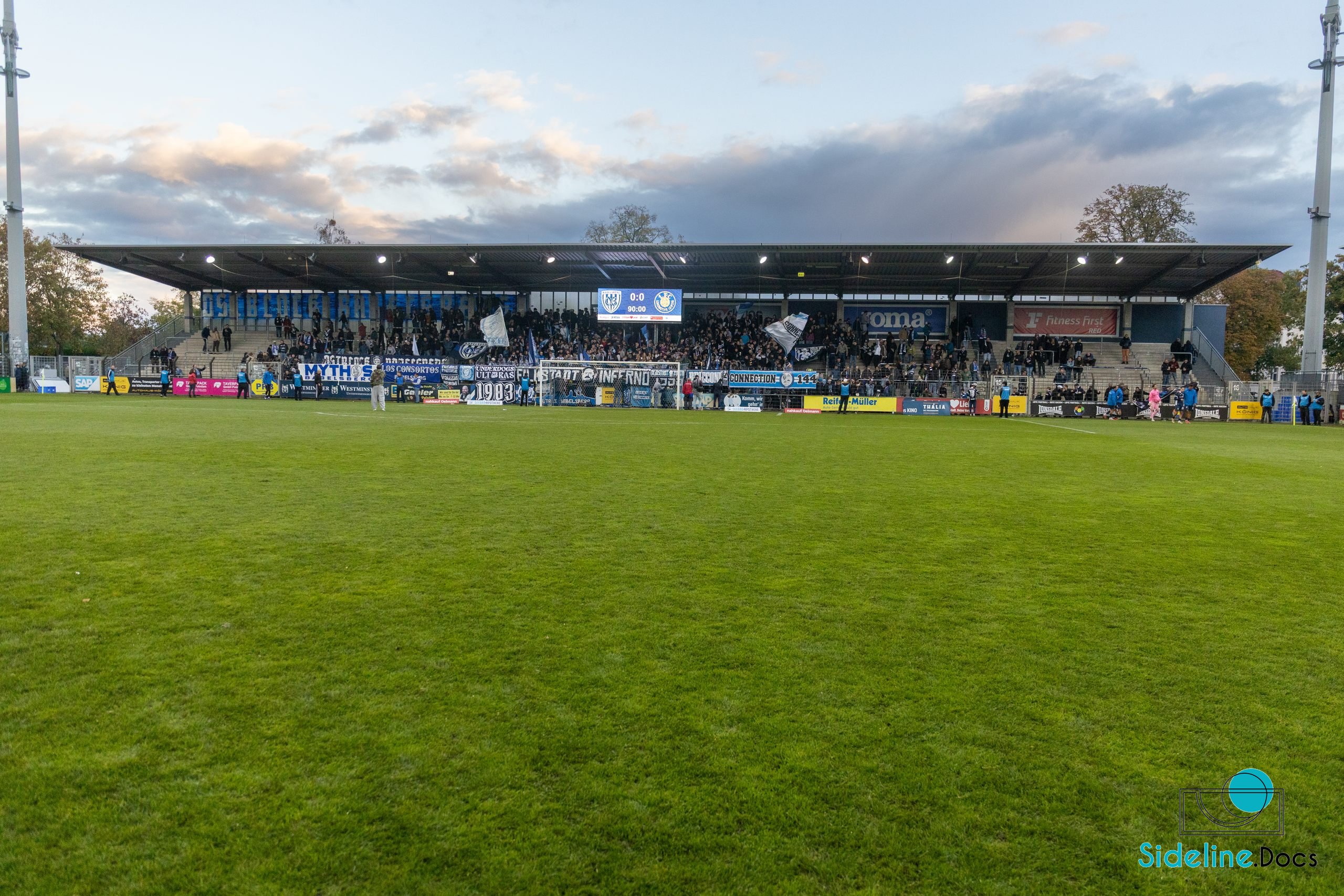 Wide daylight view of the covered stand and pitch
