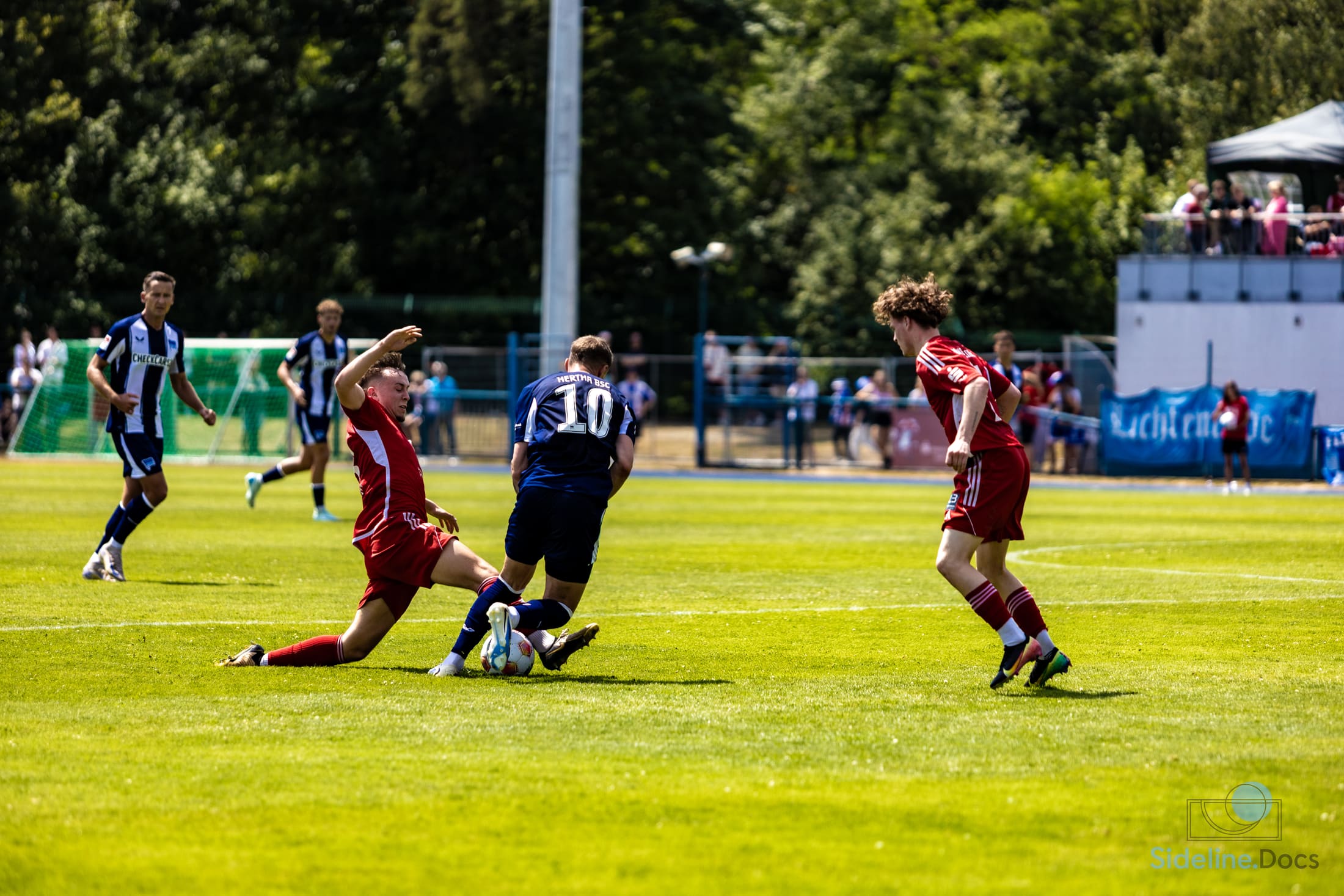 Tackle against Hertha 10, Lichtenrade banner in the background