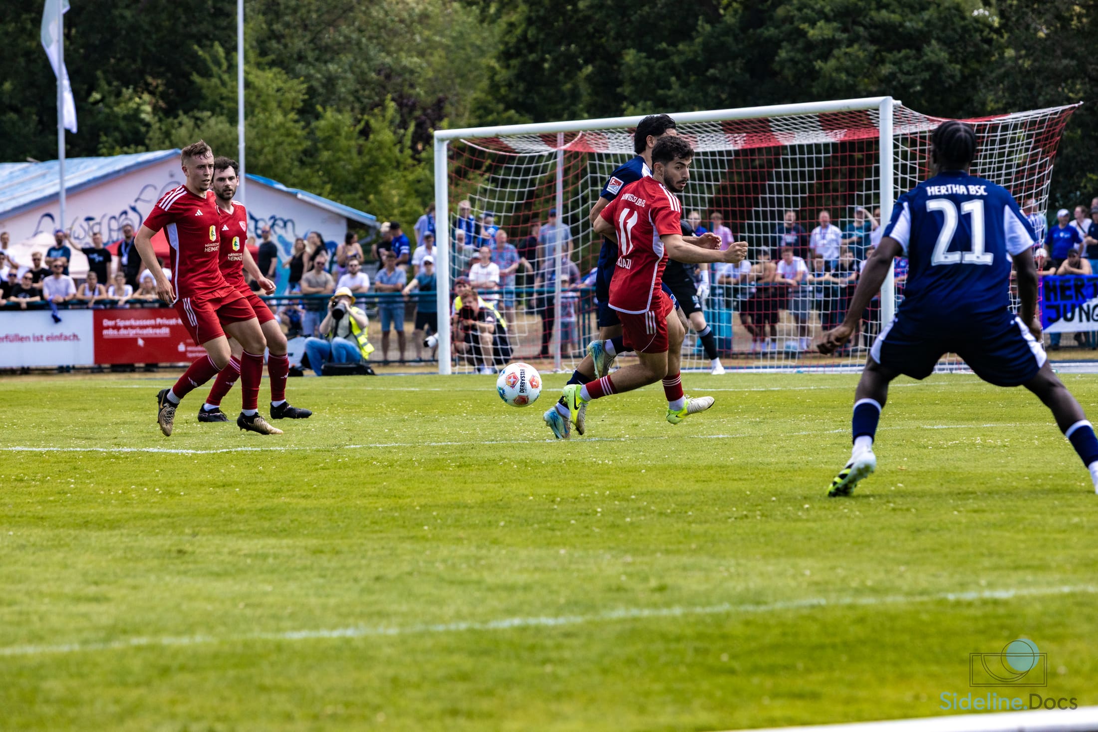 Penalty-box scene, ball in the air in front of goal